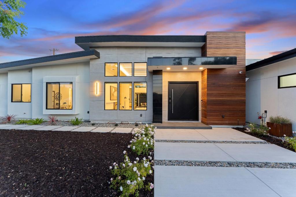Modern luxury in a newly built, light-filled Saratoga home totaling 3,822 sgft. Main home: 3,200 SF, 4 beds, 4.5 baths. Detached ADU: 622 SF, 1 bed/1 bath. Elegant design w/ soaring 13ft ceilings. Eco-smart features: owned solar, 2 EV chargers,smart home system w/ central lighting control,individual room-controlled A/C(3 HVAC units),skylights, 3,500W LED strip lighting,high-end AV processing w/ ceiling speakers, 6 security cam.Chef's kitchen w/ large island, Leicht German cabinets, 60 Thermador fridge, 48 sink w/ built-in accessories, Futuro hood, & dual pantries. Open living/dining with designer fireplace/TV wall, wine wall, sconces, & premium finishes.Enjoy seamless Indoor-outdoor living at its best w/ 1,940 SF combined space including 400 SF covered patio built to indoor specs w/ skylights, heater, fan, & panoramic doors perfect for entertaining. Luxurious touches: floor-to-ceiling tiled baths, frameless glass doors& windows, solid modern interior doors, 550 sqft primary suite w/ radiant floors, bidet, custom cabinets, fully insulated garage, accent walls. Exterior features: partial metal roof,Brazilian wood, Porcelanosa tile, grand entry door, metal garage door. Highly rated Marshall Ln Elementary. Close to shops,restaurants,Quito Park, Harker, Mitty, Hwy 85& planned Costco!