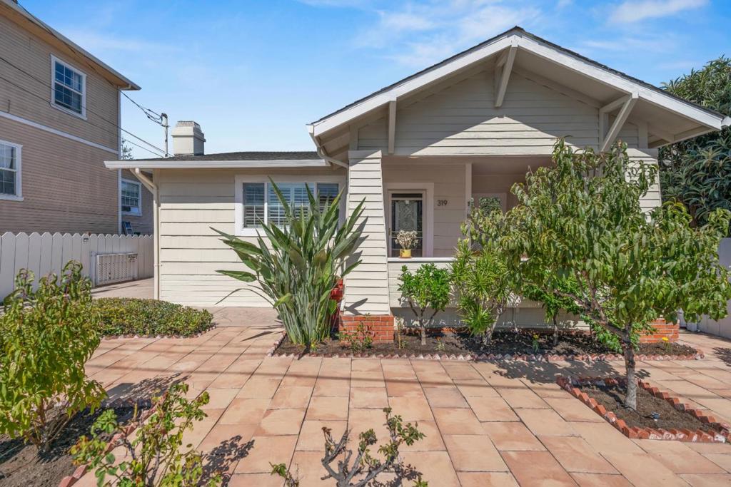 This charming updated home in the heart of Redwood City beautifully blends historic character with urban comfort. Imagine mornings filled with natural light streaming across gleaming wood floors, coffee enjoyed on the inviting front porch, and evenings gathered by the cozy fireplace. The open layout creates a warm flow from the living area to the modernized kitchen, where granite counters, custom wood cabinetry, and stainless steel appliances make both cooking and entertaining a delight. Retreat to the private primary suite with its own ensuite for quiet relaxation, while two additional bedrooms and another updated bath provide comfort and flexibility. Outdoors, the backyard becomes your private oasis with low-maintenance turf, mature fruit trees, and a versatile accessory building complete with a full bath. Ideal for guests, a studio, or a home office. With an expansive stamped-concrete driveway, gated entry, and proximity to downtown Redwood City, Caltrain, parks, and major tech campuses, this home offers not just a place to live, but a lifestyle of convenience, charm, and possibility.