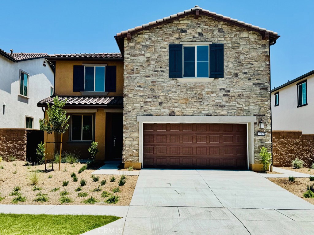 WELCOME HOME TO LUXURY AND TRANQUILITY!! This construction completed May 2024. Don't miss the opportunity to live in this stunning plan 2 home in the Harper at Bedford Community!! This beautifully designed residence is an entertainer’s dream, featuring a spacious open-concept layout that seamlessly connects the kitchen and dining areas. The kitchen boasts abundant cabinetry, a walk-in pantry, and plenty of counter space for gatherings and everyday living. Downstairs, you’ll find a versatile flex space ideal for a home office or den, plus a generously sized bedroom with direct access to a full bathroom — perfect for guests or multigenerational living. Upstairs, enjoy a large entertainment/loft area, a spacious laundry room, and two additional bedrooms with a shared full bathroom. The primary suite is a true retreat, offering a vast walk-in closet, luxurious soaking tub, and oversized shower. Additional features include a new solar system, a whole-home air filtration system, 2-car attached garage plus 2-car driveway parking. Enjoy the lifestyle and amenities of the Bedford community while living in a home that blends elegance, comfort, and functionality.