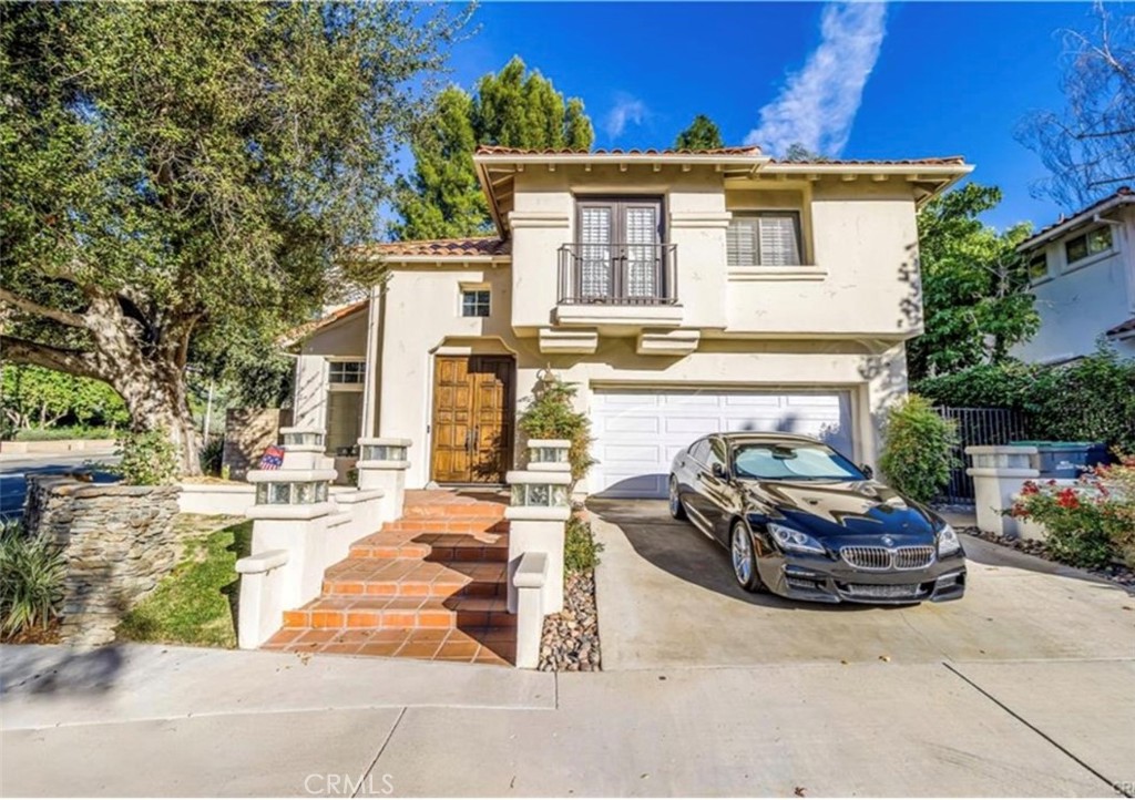 Exquisite 4-Bed, 2.5-Bath Furnished Home in The Oaks – Nearly 3,000 Sq Ft of Upgraded Living Space
This beautifully upgraded 4-bedroom, 2.5-bathroom home offers nearly 3,000 sq ft of refined living in the highly desirable The Oaks community. Situated on a prominent corner lot, the home boasts stunning curb appeal and a long list of modern updates, including new engineered hardwood flooring, crown molding, thick baseboards, recessed lighting, plantation shutters, and skylights.
Enter through grand double doors into a formal living room featuring a central fireplace, soaring ceilings, and an open flow into the step-up formal dining room, highlighted by French doors that lead to a serene backyard patio. Just past the dramatic curved staircase, a built-in wet bar connects to the inviting family room with a second fireplace—perfect for entertaining.
The fully remodeled chef’s kitchen is a showstopper, equipped with white shaker cabinets, quartz countertops, a subway tile backsplash, and a spacious center island with a 6-burner cooktop. Additional features include stainless steel appliances, a double wall oven, convection oven, breakfast nook, and a built-in Viking Professional wine fridge. A stylish powder room completes the main level.
Furniture is not as pictured in the photos.
Upstairs, you’ll find a dedicated laundry room, three spacious secondary bedrooms, and a luxurious primary suite with double-door entry. The en-suite bath has been completely reimagined with a freestanding soaking tub, dual sinks, a glamorous vanity area, and a walk-in shower with bench seating and dual shower heads.
The beautifully landscaped backyard is an entertainer’s dream—featuring a wraparound patio (partially covered by a pergola), a fire pit, and a fully equipped outdoor BBQ area with bar seating.
Residents of The Oaks enjoy access to community amenities including a pool, spa, and outdoor cooking/picnic area. Conveniently located near the 5 Freeway, top-rated schools, shopping, and dining.
House will be leased furnished.