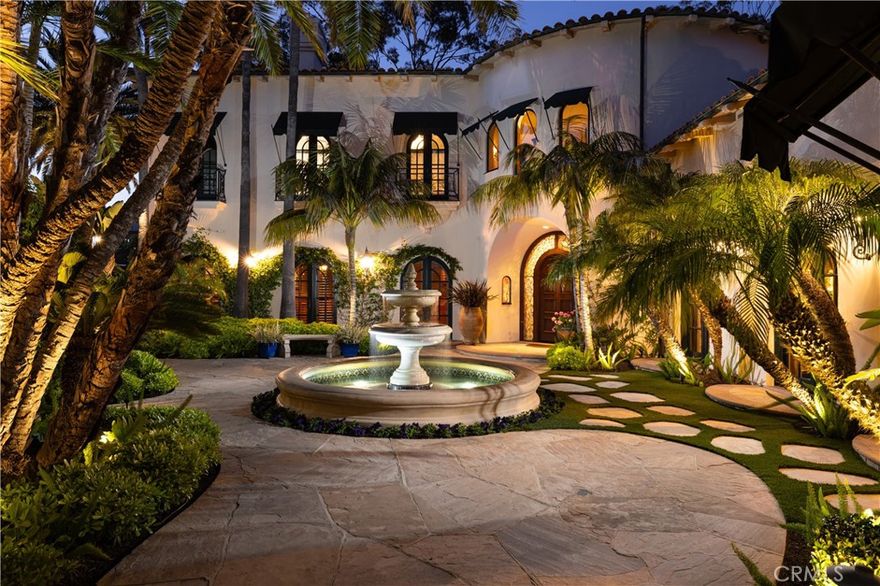 The Heart of Bear Brand Ranch. An unrivaled estate set on nearly an acre of gated privacy, surrounded by untouched land and rolling hills, 19 Old Ranch Road is a rare jewel in the prestigious enclave. Masterfully designed in timeless Spanish architectural tradition, the residence is enveloped by mature, lush landscaping—towering trees, vibrant gardens, and meandering pathways that evoke the romance of European countryside estates or the glamour of Old Hollywood. With commanding views stretching across the Capistrano Valley, Saddleback Mountains, and out to the Pacific Ocean and coastline, this sanctuary offers an unparalleled sense of serenity and grandeur. Expertly crafted, passionately designed, and meticulously maintained, the home features expansive grounds that invite refined indoor-outdoor living. A stunning resort-style pool with a cascading waterfall takes full advantage of the sweeping vistas. Anchoring the outdoor experience is a fully appointed cabana complete with a fireplace, bar, and lounge—an entertainer’s dream and a private escape in one. Inside, the residence offers a flowing, functional floorplan with 6 expansive and curated bedrooms, each with it's own en-suite bathroom seamlessly blending elegance with comfort. The dramatic great room to the outdoor spaces through custom steel French door, while the formal living space showcases a statement fireplace, stunning seating arrangements, offering a sense of refined luxury. A warm, inviting family kitchen and an intimate dining room with coffered ceilings connect to a private courtyard adjacent to a palm-filled atrium. The main-level hosts a sumptuous primary-bedroom suite offering views, privacy and elegance with spa-like steam shower, soaking tub, and custom closets . A secondary guest retreat, a formal office, a fitness room, and multiple entertainment spaces. Upstairs, four additional guest suites offer unique features, including a private casita with separate entrance, kitchenette, and living area—ideal for multi-generational living or guests. Additional rooms include a playroom, bonus lounge, and two bedrooms with charming Juliet balconies. Thoughtful details abound: a custom wine cellar, sauna, pool bath, and hidden garden paths that lead to tranquil seating areas and moments of discovery. An elevated in-ground spa, romantic fountains, private firepit terrace draped by mature pepper trees, and dramatic gated porte-cochere with four-car garage add to the home's irresistible ambiance.