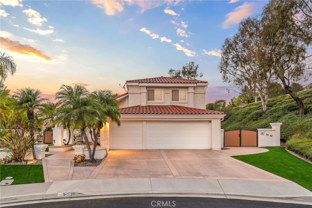 Absolutely breathtaking renovated residence situated on an interior end of a single loaded cul-de-sac street on a landmark expansive lot that encompasses nearly 20,000 square feet and includes a stunning entertainer’s wrap around pool and spa patio yard and space enough to comfortably park your RV, boat, or your latest project custom car. Truly exceptional for Marina Hills and is a must see triumph for the community. Starting with picture perfect curb appeal including high-end artificial turf, welcoming mature planting beds in a truly inviting front porch with a set of custom, elegant double doors. Stepping inside you are greeted by an elegant foyer featuring a sweeping curved custom staircase which is open to the striking light and bright formal living and dining rooms that feature great space and an abundance of natural light from large windows. Next are the completely updated chef’s kitchen and a spacious family room. With updated professional grade stainless steel appliances, bright white quartz counters – including a convenient center prep island, recessed lighting and great light from a large over sink window, a large walk-in pantry and a breakfast bar peninsula that opens to the family room this kitchen will be where all the magic happens. The family room is spacious and light and features a warm focal point fireplace. A highly sought after downstairs bedroom and a fully renovated three quarter guest bath, and a clean and bright indoor laundry room, complete the lower-level living spaces. Up the sweeping custom stairs, the primary wing features a generously sized light and bright bedroom that is compliments by the completely redone spa-like ensuite with custom tile, a quartz dual sink vanity, a soaking tub, a step-in shower, a privacy water closet door and a sizable walk-in closet. Three additional guest bedrooms and a fully renovated guest bath complete the upper living spaces. Outside you’ll find an entertainer’s dream custom hardscape pool and spa yard that has ample space to relax, entertain and play in complete privacy and comfort with a large portion that is completely covered. Located in the highly sought after, near coastal, enclave of Marina Hills enjoy access to exceptional facilities including a pool and spa complex, tennis and pickleball courts, playgrounds, various parks, access to beach reaching walking and biking trails and all of this with comparatively low HOA dues! This is the one. Welcome Home!