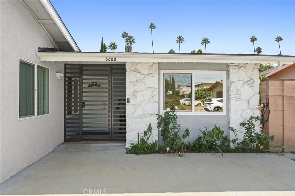 Welcome to 6620 Lenox Avenue, a spacious 5 bedroom, 3 bathroom home tucked away on a quiet cul-de-sac in the heart of Van Nuys, Sherman Oaks-adjacent. This property combines modern upgrades and flexible living. The main residence offers approximately 1,890 sf. with 4 bedrooms and 2 bathrooms, while the attached ADU at 6622 Lenox Avenue adds an additional 440 sf. with 1 bedroom and 1 bathroom. Built in 2019 with permits and a certificate of occupancy, the ADU includes its own split system, tankless water heater, and separate metering for gas and electricity, making it a fully independent living space perfect for guests, extended family, home office, or rental income. The ADU is gated for privacy and security and is currently tenant-occupied, providing immediate rental income potential. This home has been thoughtfully updated and meticulously maintained over the years. Major improvements include a brand-new roof (2024), attic insulation (2022), dual-pane windows (2019), and a newer HVAC system/ducts (2018). Copper plumbing was replaced in 2018, and a 200-amp electrical panel was upgraded in 2024. The property is fully enclosed with vinyl fencing (2021) and secured with a metal gate at the entrance for added privacy. The backyard features recently poured cement (2022) plus some turf, a covered patio with tile flooring and recessed lights/ceiling fan (2024), and multiple fruit trees—making it both functional and inviting for outdoor enjoyment. Both side yards are generously sized, offering excellent potential for future additions or expansions to the home, and one side yard also includes a shed for extra storage. The house is also equipped with EV charging capability, and the large driveway provides plenty of parking for multiple vehicles. Inside, the main home showcases elegant upgrades including laminate flooring throughout, crown molding in the living room, recessed lighting on dimmers, and high-end solid wood interior doors installed in 2022. The kitchen is equipped with all stainless steel appliances including a new hood (2024), dishwasher (2019), refrigerator (2023), double oven, and additional cabinetry for added storage near the breakfast nook. Plus the separate laundry room and newer washer/dryer (2023) offers added convenience. Blending comfort, practicality, and modern living, this home offers a rare opportunity for multi-generational living or income potential in a desirable location. Come see it for yourself—you’re sure to fall in love.