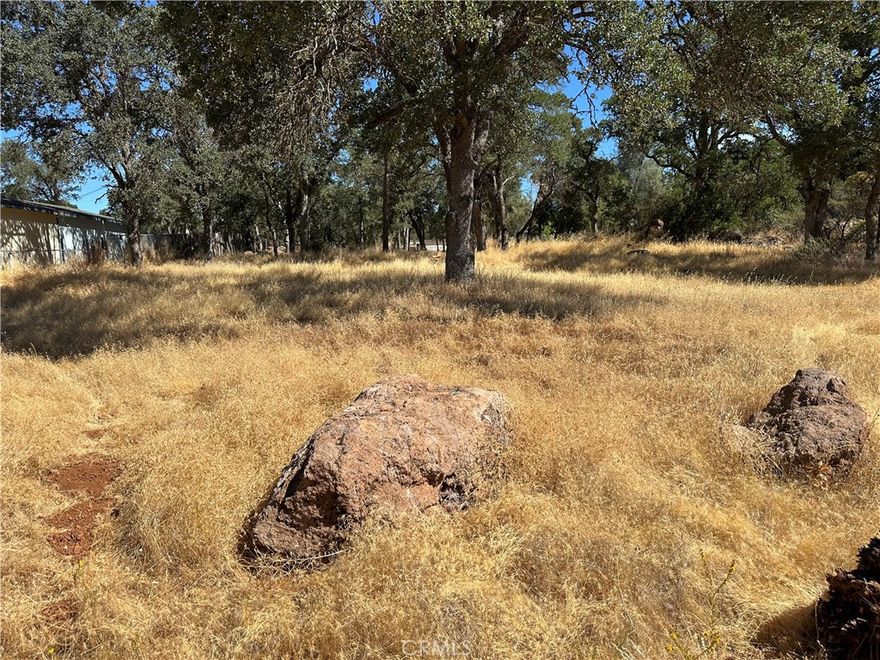 Nice double sized lot above Clearlake. at the end of a paved road. Lot is level.