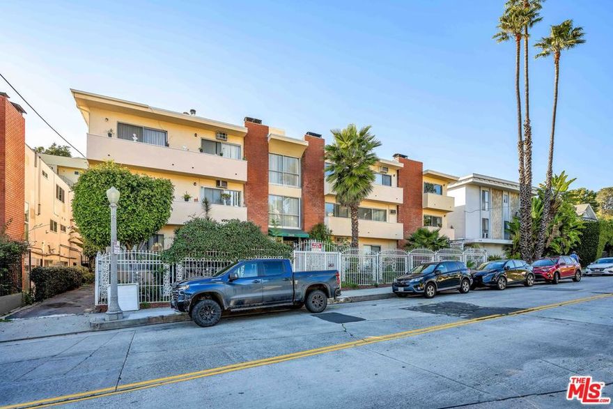 7 of 14 UNITS VACANT! We are pleased to present the opportunity to acquire a highly unique 14-unit apartment building in the renown and sought-after Beachwood Canyon neighborhood of Hollywood, CA. 2449 N Beachwood Dr was built in 1968 with many classic mid-century elements including wet bars, fireplaces, 2-story layouts and jack-and-jill bathrooms. The building sits under the shadow of the world-famous Hollywood sign and is only a short walk from neighborhood staples like the Beachwood Cafe and Beachwood Market. 11 of the 14 units are 2-story townhouse style featuring 2 bedrooms and 1-1/2 bathrooms with an average size of 1400 square feet. There is on-site laundry, parking for 18 vehicles and the building has controlled access. The roof was recently replaced with permits and the soft story retrofit has been completed with a certificate of compliance issued by the city. A total of 7 currently vacant units makes this a particularly compelling opportunity as it allows a buyer to immediately renovate and lease up half of the building's units at market rents. Recently renovated 2-bedroom units in 1960s construction buildings further south on Beachwood are renting for $4200. Those are smaller, single-level units. The tremendous rental upside potential of Beachwood Canyon is due in large part to the area's popularity and reputation among out-of-state transplants willing to pay sizable rents for well-appointed units on the venerable street. 2449 N Beachwood offers an astute investor the immediate opportunity to create a high-luxury, midcentury gem in one of the most desirable submarkets in the city.