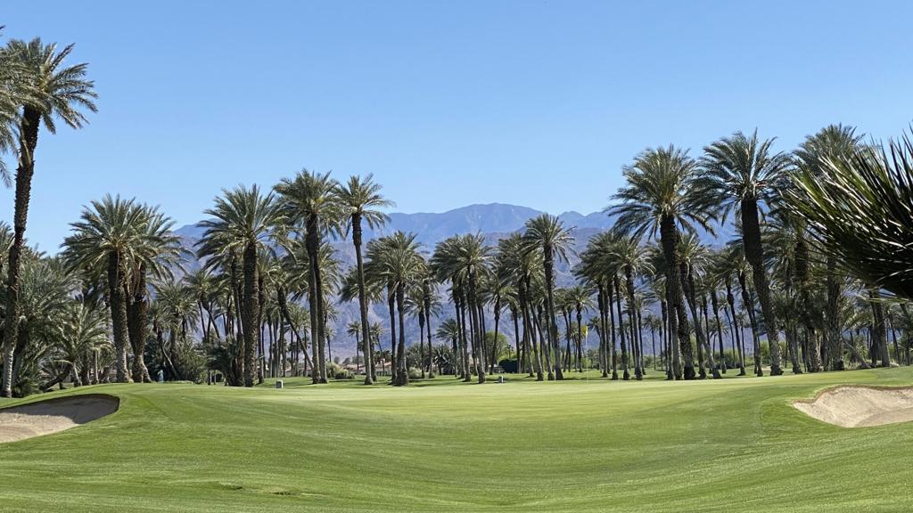 Located in the prestigious South La Quinta community of The Palms, this beautiful semi-custom home offers dramatic south-facing golf course views overlooking the meticulously maintained fairways and greens of The Palms Golf Club. From the 15th green to the iconic date palms and the striking Santa Rosa Mountains, the backdrop is nothing short of breathtaking.Spanning approximately 2,883 sq. ft., the residence features 3 bedrooms and 3.5 baths, including a spacious detached casita with its own French double-door entrance. A formal entry opens to the light-filled Great Room, where soaring ceilings, a travertine-surround fireplace, and walls of glass showcase the panoramic views. The gourmet kitchen is a chef's delight with a center island, a large wraparound slab-granite bar, and high-end GE Monogram appliances, including double ovens, built-in refrigerator, microwave, cooktop, and dishwasher. The adjacent dining area is enhanced by a sculpted metal chandelier with glass and crystal details.The den, with French doors, laminate wood flooring, and a Murphy bed, offers flexible use as an office or guest retreat. The builder-enhanced primary suite is a true sanctuary with an extended sitting area, travertine-surround fireplace, and direct access to the pool and spa. The luxurious bath includes slab-granite counters, dual vanities, a makeup station, spa tub, step-down shower, and a custom walk-in closet. The guest suite boasts a private bath with granite counters and Granite tile shower, while the oversized casita features dual vanities and a walk-in shower.Additional highlights include elegant travertine flooring throughout the main living areas, newer high-end carpet in the bedrooms, a laundry room with sink, and a 2-car plus golf cart garage with mini-split AC and Tesla charging station. Outdoors, the backyard is designed for resort-style living with a covered patio, fireplace, built-in BBQ, wet bar with refrigerator, and stunning golf course vistas. The entry courtyard, with tower, fountain, and lush landscaping, sets a welcoming tone.Tastefully furnished and beautifully decorated, this home is ready for immediate enjoyment. The Palms is an exclusive 24-hour guard-gated community of only 101 custom and semi-custom homes, just minutes from the restaurants and shops of Old Town La Quinta.
