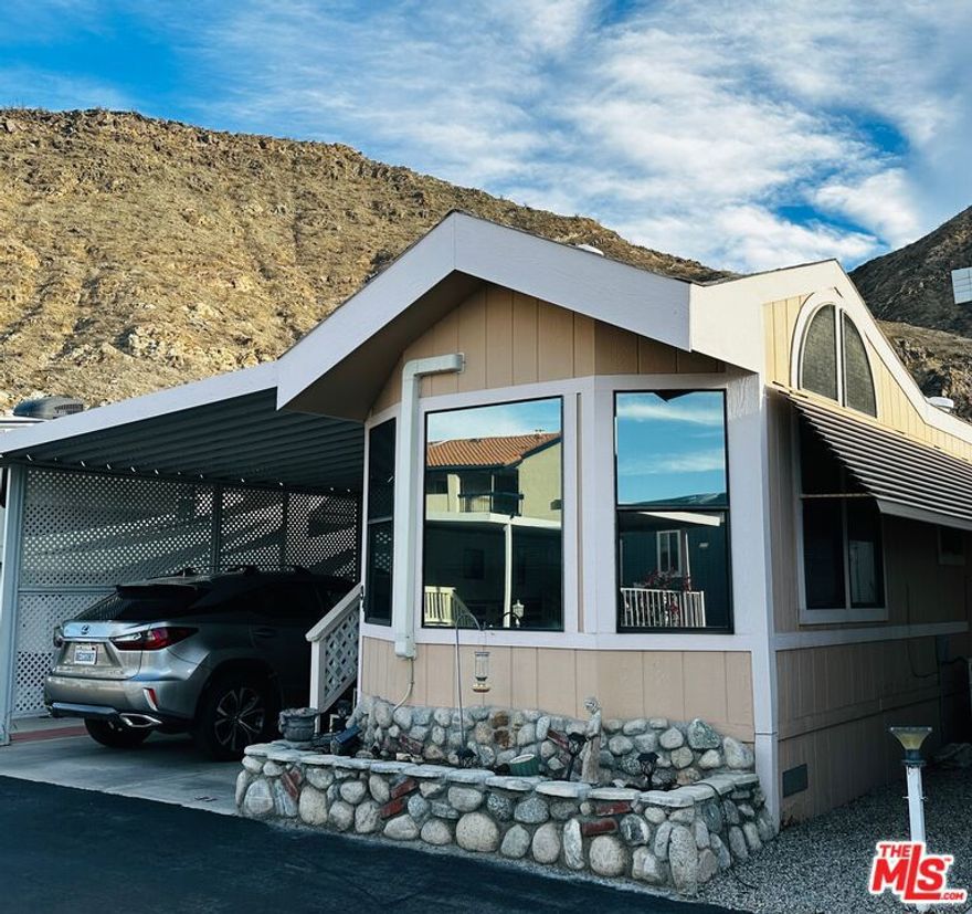 Live large in this cute & clean tiny home! Perfect for a Palm Springs area getaway, or a full-time residence. It features a clever layout for comfortable living in a community central to all the Coachella Valley has to offer. With a well designed living room & dining area, galley kitchen, large bath, a generous second bedroom that opens to a private deck, and even a laundry area with full size washer & dryer, this home shines. Close to shopping and restaurants, Sungate is one of the most affordable communities in the Coachella Valley - with a low land lease of just $96 per month & an HOA of only $228 per month. Sungate is a 55+ community. Land is lease-hold ownership.