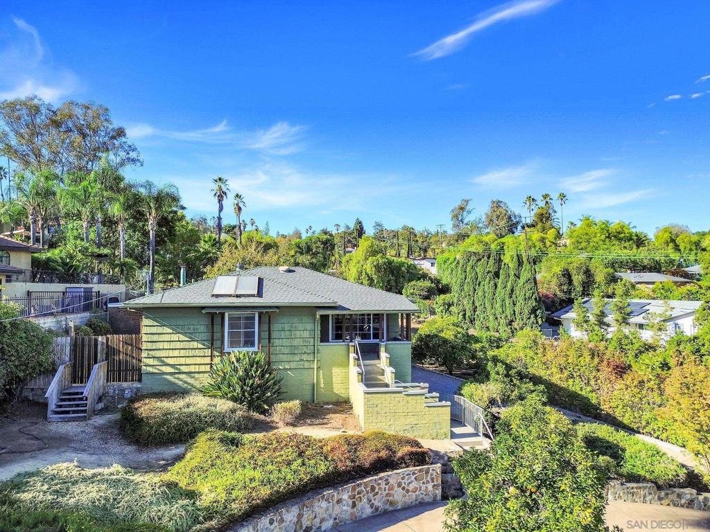 Dreaming of a little country in Mt. Helix? Let the fragrance of orange blossoms & breathtaking sunrises welcome you home to your private .72-acre paradise in La Mesa. This 3-bedroom, 2-bath home blends rustic serenity with modern comfort. Inside, the big bay window opens to the sky, the orchard, and moonrises, while the expansive living room offers wall-to-wall treetop views and pink sunsets. A modern kitchen with 6-burner gas stove flows into the dining room—perfect for gathering family and friends. Step outside to a flourishing orchard of pink lemon, citrus, and avocado trees with room for grapevines. Practicality meets potential with an extra-long driveway, circular concrete drive, RV/boat parking, and two dump stations. The separate rear building with electricity is already a versatile asset—currently perfect for parking or workspace, but with its generous yard frontage, it’s an ideal setup for a future ADU. Beneath the home, discover stand-up storage with shelving—wine cellar, workshop, or creative hub. Add in the art studio and the private downstairs suite with modern bath and its own entrance, and you’ll find the home offers both charm and flexibility. This isn’t just a residence—it’s a lifestyle canvas in the heart of Mt. Helix, with panoramic views of the Peninsular Range, country air, and boundless opportunity. Dreaming of a little country & breathtaking sunrises in Mt. Helix? Let the fragrance of orange blossoms welcome you home to your private .72-acre paradise in La Mesa. This 3-bedroom, 2-bath home blends rustic serenity with modern comfort. Inside, the big bay window opens to the sky, the orchard, and moonrises, while the expansive living room offers wall-to-wall treetop views and pink sunsets. A modern kitchen with 6-burner gas stove flows into the dining room—perfect for gathering family and friends. Step outside to a flourishing orchard of pink lemon, citrus, and avocado trees with room for grapevines. Practicality meets potential with an extra-long driveway, circular concrete drive, RV/boat parking, and two dump stations. The separate rear building with electricity is already a versatile asset—currently perfect for parking or workspace, but with its generous yard frontage, it’s an ideal setup for a future ADU. Beneath the home, discover stand-up storage with shelving—wine cellar, workshop, or creative hub. Add in the art studio and the private downstairs suite with modern bath and its own entrance, and you’ll find the home offers both charm and flexibility. This isn’t just a residence—it’s a lifestyle canvas in the heart of Mt. Helix, with panoramic views of the Peninsular Range, country air, and boundless opportunity.