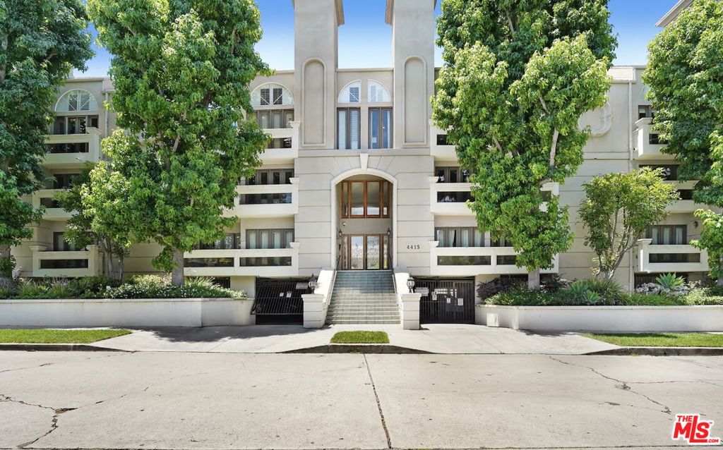 Located in one of Sherman Oaks' most sought-after neighborhoods, this beautifully renovated townhome-style condo is just steps away from Whole Foods, Burke Williams, Regal Cinemas, acclaimed restaurants, and charming local cafes. Upstairs, the bright reverse floor plan offers an open-concept living space featuring a spacious living room with a stunning fireplace, a dining area with a sleek wet bar and a chef-inspired kitchen equipped with stainless steel appliances, rich cabinetry, and ample counter space. Downstairs, the serene primary suite boasts a walk-in closet, a second fireplace, and a spa-like ensuite bath complete with a freestanding soaking tub, marble double vanity, and a luxurious rain shower. The second bedroom includes its own full bath ideal for a guest suite, nursery, or home office and opens through French doors to a private patio overlooking lush courtyard greenery. Additional features include secure building entry, two assigned parking spaces in a gated subterranean garage, and a private storage area. This beautiful neighborhood combines suburban charm with urban convenience, tree-lined streets, top-tier schools, parks, and easy access to the 101 and 405 freeways. Located close to the Sherman Oaks Galleria and LA's vibrant media hubs, it's a perfect blend of comfort and connectivity.