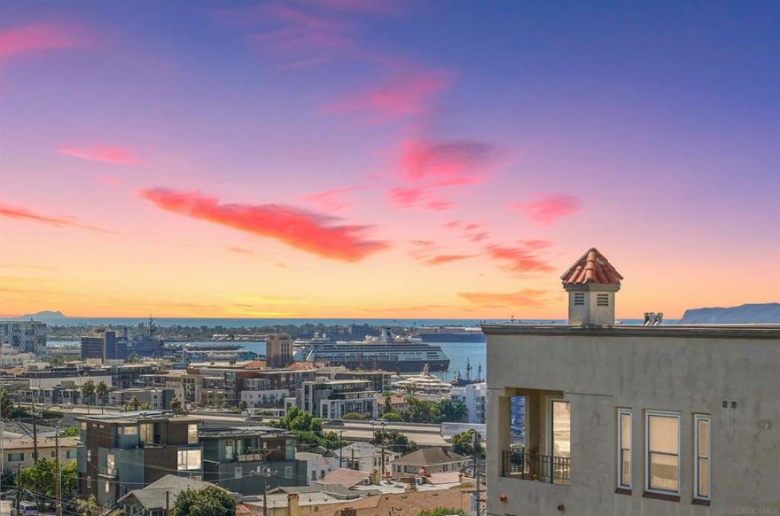 Elevate your lifestyle in this rooftop-accessible corner residence located in the heart of prestigious Banker’s Hill. One of just four homes on the entire floor, this rare upper-level condo offers exceptional privacy paired with the convenience of dual elevator access. Take in sweeping southwest-facing views spanning the Pacific Ocean, San Diego Bay, Downtown skyline, Point Loma, and the Coronado Islands—plus enjoy front-row balcony views of the iconic Big Bay Boom fireworks. The home has been recently remodeled and thoughtfully updated throughout, featuring refreshed living spaces, remodeled bedrooms and bathrooms, new recessed lighting, luxury vinyl flooring, upgraded interior doors, a new A/C handler, designer toilets, and more. The open-concept layout is enhanced by soaring 9+ foot ceilings, a cozy gas fireplace, full-size in-unit washer/dryer, newer dual-pane vinyl windows, and generous closet space across two spacious bedrooms and two full bathrooms. In addition to street parking, the residence includes two secure underground assigned parking spaces and a private lockable storage shed. Villa Portofino offers resort-style amenities including a pool, spa, BBQ area, beautifully landscaped grounds, and a fitness center. Experience refined Uptown living just minutes from Balboa Park, the culinary scene of Little Italy, and the energy of Downtown San Diego