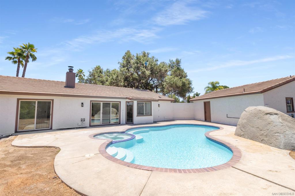 Welcome home to this stunning single-story retreat tucked away at the end of a peaceful cul-de-sac in highly desirable Southwest Escondido. This fully renovated 4-bedroom, 4-bathroom residence offers modern luxury, privacy, and versatility—complete with an attached ADU, ideal for guests, extended family, or rental income. Step inside to an open-concept layout featuring brand new luxury vinyl plank flooring, a bright formal living room, and a spacious family room with vaulted ceilings, and a cozy fireplace. The heart of the home is a chef’s dream kitchen—boasting a large center island with waterfall quartz counters, new white shaker cabinetry, stainless steel appliances, and designer finishes throughout. The luxurious primary suite is a true retreat, featuring mountain views, a spa-inspired ensuite with a glass-enclosed shower, freestanding soaking tub, and dual vanities. Every bathroom has been tastefully updated with premium fixtures and finishes. Enjoy year-round entertaining in your private backyard oasis—highlighted by a newly remodeled pool and spa, extended yard space for gardening or a chicken coop, outdoor play area or room to build an additional detached ADU while maintaining tranquil views of the surrounding hills. Additional upgrades include a new roof, new HVAC system, tankless water heater, dual-pane windows, and a 2-car garage. The attached ADU offers incredible flexibility and value with its own separate entrance. Ideally located just minutes from Rancho Santa Fe, Rancho Bernardo, Lake Hodges, shopping, dining, and top-rated schools, this move-in ready g Welcome home to this stunning single-story retreat tucked away at the end of a peaceful cul-de-sac in highly desirable Southwest Escondido. This fully renovated 4-bedroom, 4-bathroom residence offers modern luxury, privacy, and versatility—complete with an attached ADU, ideal for guests, extended family, or rental income. Step inside to an open-concept layout featuring brand new luxury vinyl plank flooring, a bright formal living room, and a spacious family room with vaulted ceilings, and a cozy fireplace. The heart of the home is a chef’s dream kitchen—boasting a large center island with waterfall quartz counters, new white shaker cabinetry, stainless steel appliances, and designer finishes throughout. The luxurious primary suite is a true retreat, featuring mountain views, a spa-inspired ensuite with a glass-enclosed shower, freestanding soaking tub, and dual vanities. Every bathroom has been tastefully updated with premium fixtures and finishes. Enjoy year-round entertaining in your private backyard oasis—highlighted by a newly remodeled pool and spa, extended yard space for gardening or a chicken coop, outdoor play area or room to build an additional detached ADU while maintaining tranquil views of the surrounding hills. Additional upgrades include a new roof, new HVAC system, tankless water heater, dual-pane windows, and a 2-car garage. The attached ADU offers incredible flexibility and value with its own separate entrance. Ideally located just minutes from Rancho Santa Fe, Rancho Bernardo, Lake Hodges, shopping, dining, and top-rated schools, this move-in ready gem blends convenience, comfort, and upscale style. Don’t miss the opportunity to own this exceptional home in one of Escondido’s most sought-after neighborhoods.
