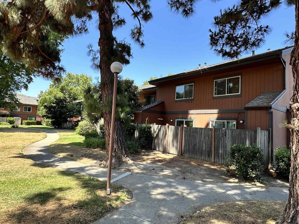 Welcome to this inviting 2-story townhome located in a quiet, tree-lined community in Fremont. This home is part of a well-maintained complex with mature trees, wide greenbelts, and paved walkways that create a peaceful, park-like setting. A highlight of the community is the large swimming pool and sun deck, perfect for relaxing or enjoying the outdoors with family and friends. Enjoy the benefits of a serene, walkable neighborhood with excellent shared amenities in a convenient Fremont location.