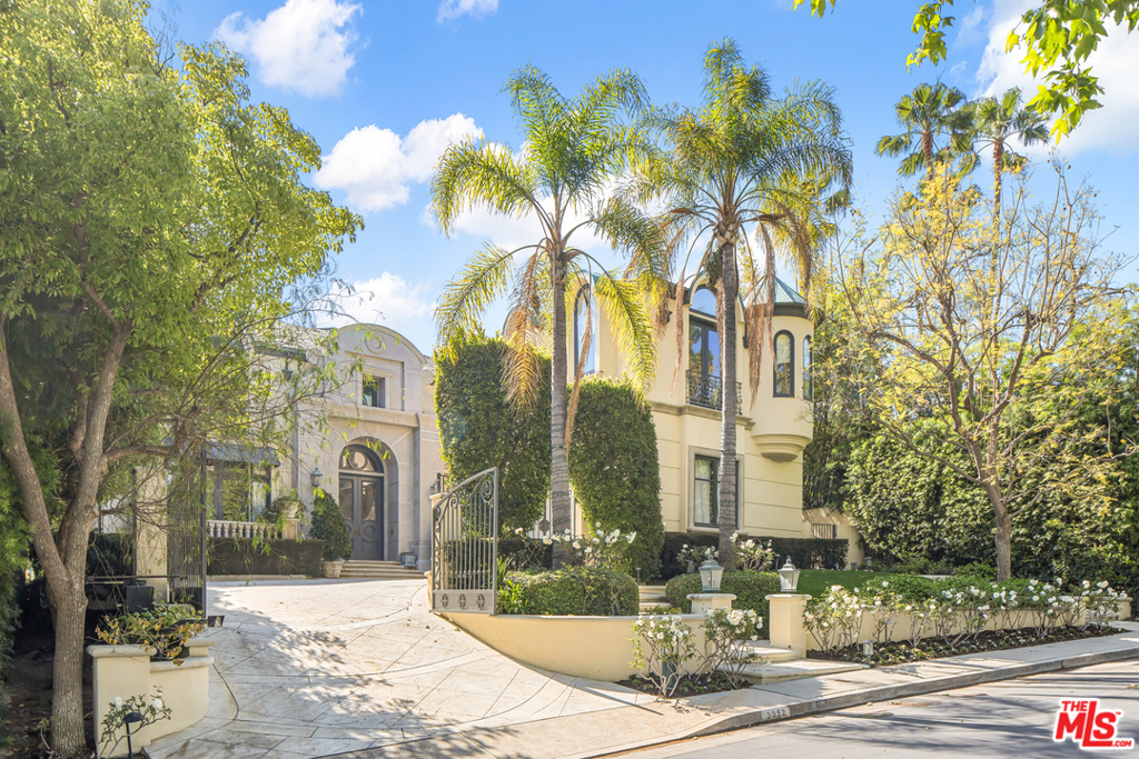 A spectacular French Chateau estate situated on over a half-acre with the best views in Mulholland Estates, a 24-hour guard gated community. Enter a world of luxury behind iron gates, featuring a grand 2-story foyer & sweeping spiral staircase, large formal living room with herringbone wood floors, wood paneled library, family/media room, formal dining, & gourmet kitchen with marble backsplash with Viking appliances and water filtration system, which all overlook gorgeous grounds, lawns, fountain, and beautiful views. The grand owner's bedroom suite includes a step-down sitting area with a 2-sided fireplace, custom marble bath with a deep soaking tub and spa-like sauna. Incredible private backyard includes a sparkling swimming pool, spa, lounge area and built-in BBQ. An absolute entertainer's paradise, an incredible value, priced to sell.