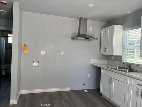 Photo of 1215 1/2 W104th St, Los Angeles, CA 90044 (MLS # PW26099613)
