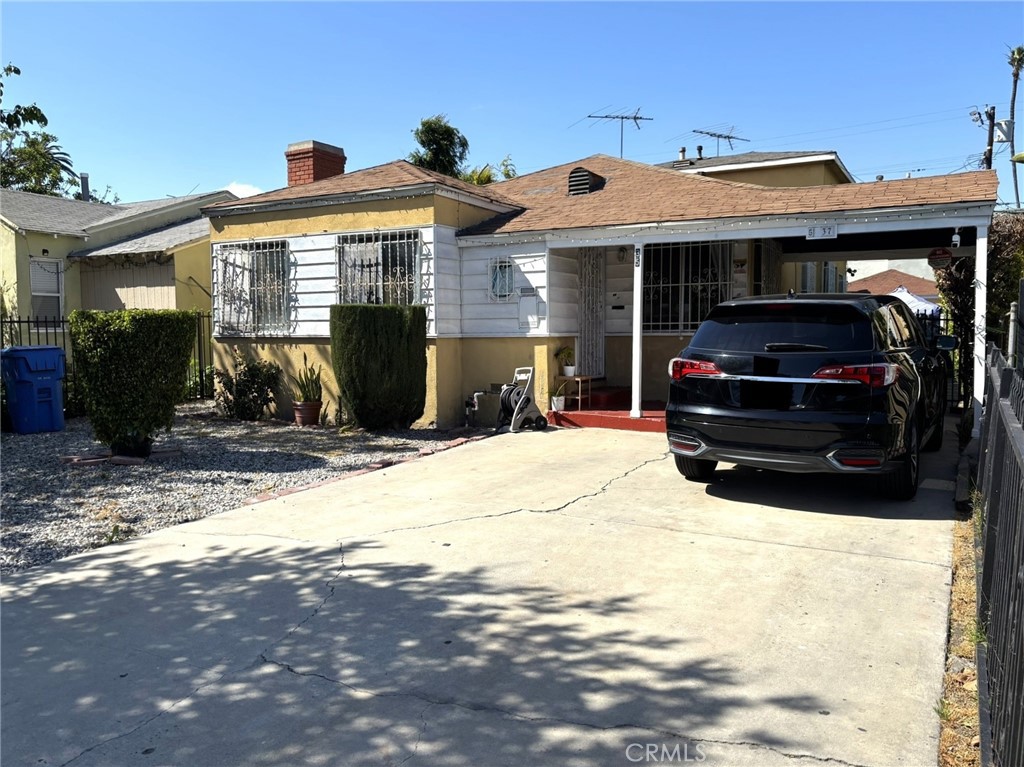 Great investment opportunity in Los Angeles! This property features two units plus a legal detached bonus room in the back. The front unit offers 2 bedrooms, 1 bathroom, a spacious living room, dining room, kitchen, and a laundry/mud room conveniently located off the kitchen with direct access to the driveway.. The back unit is a two-story layout: the first level includes a living room, dining room, kitchen with pantry storage, laundry hook-up, and a three-quarter bathroom with a separate sink station. Upstairs, you’ll find an additional living room, 2 bedrooms, and 1 bathroom. The backyard features a storage shed and a covered patio—ideal for outdoor living. Added security elements include window bars, metal security doors, and a gated driveway. Both front and back yards are fully fenced for privacy, and the long driveway provides ample parking for multiple vehicles.