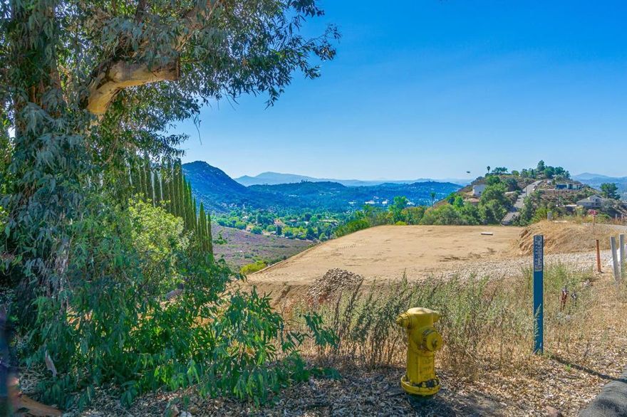 ***Shovel Ready Homesite with Approved Plans and Utilities in Place! All the time-consuming preliminary work has already been completed—this exceptional lot is fully prepared for immediate construction. Approved architectural plans are in place for a beautifully designed 2,580 sq ft residence featuring 3 spacious bedrooms and 3 well-appointed bathrooms. All necessary permits have been secured, and school impact fees have been fully paid, saving you both time and money. **Essential utilities, including water and electricity, are already available at the site, and the lot has been professionally graded to meet building requirements. Situated on a peaceful parcel of land, this property offers breathtaking, unobstructed 180° views of majestic mountain ranges—an ideal setting for your dream home. ***Don't miss this rare opportunity to begin building right away. With everything ready to go, you can focus on bringing your vision to life without delays. Schedule a visit and take the first step toward your future home today!