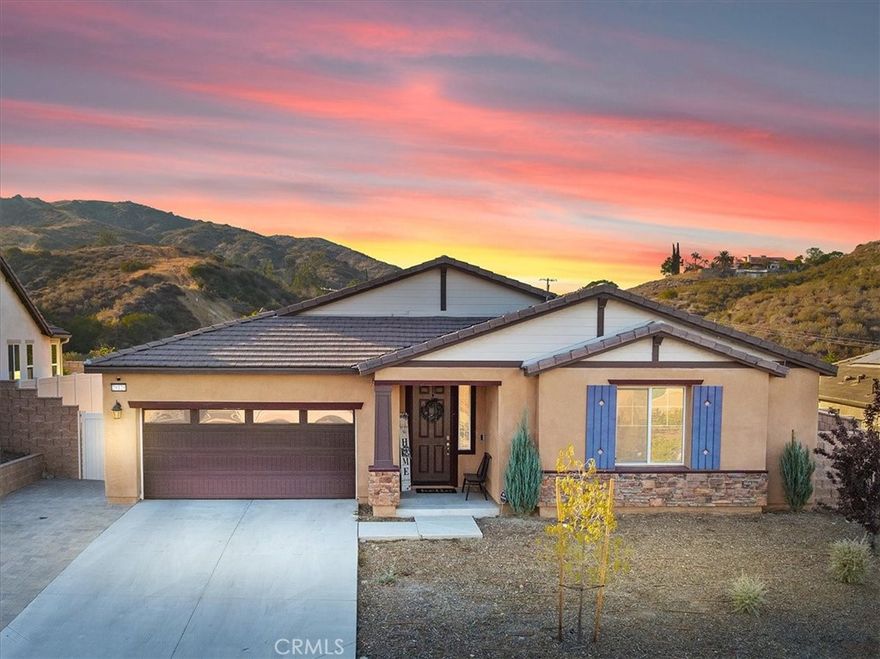 Welcome to this stunning Single-Story residence offering 2,514 sq. ft. of thoughtfully designed living space with 4 Bedrooms, 3 Bathrooms, perfectly blending functionality and luxury. With no neighbors behind and stunning views of the local mountains, this home has a peaceful feeling. Three of the Bedrooms are located in the front of the home, two of which are connected by a Jack and Jill bathroom, and one with its own hallway bathroom providing comfort for family or guests. The Primary Bedroom Suite is tucked away at the back of the home offering added privacy. The Primary suite feels like a peaceful retreat with a custom barn door leading into a spa-like bathroom featuring dual sinks, a walk-in shower, an oversized soaking tub, separate toilet room, and a spacious walk-in closet with custom shoe shelving. The heart of the home is the Gourmet Kitchen boasting white cabinetry, Carrera marble countertops, an extended center island/countertop, stainless steel appliances, a 36-inch commercial range top, and a professional-grade stainless steel sink. It is OPEN to the Family Room and Dining Area and promotes family gatherings and entertaining. There is a Good size walk-in Pantry for food storage. Practical upgrades include a three-car Tandem Garage equipped with a tankless water heater, 240V EV charging station and two 1,500-lb overhead storage racks. The laundry room is indoors, and comes with built-in shelving. PAID OFF SOLAR through SunRun and NO HOA are MAJOR added benefits! The Whole house fan helps cool off the home quickly and efficiently during the warmer months. There is ample room for all your "toys" as this property features an extended driveway with vehicle-rated pavers designed for vehicle or boat parking at the Front Left side of the home. Enjoy California outdoor living with an extended concrete patio, alumawood patio cover, and ceiling fans with lights. Use your imagination to design the rest of the Back yard to your own desires. This home checks every box with its combination of modern elegance, thoughtful upgrades, Paid Off Solar and No HOA.
