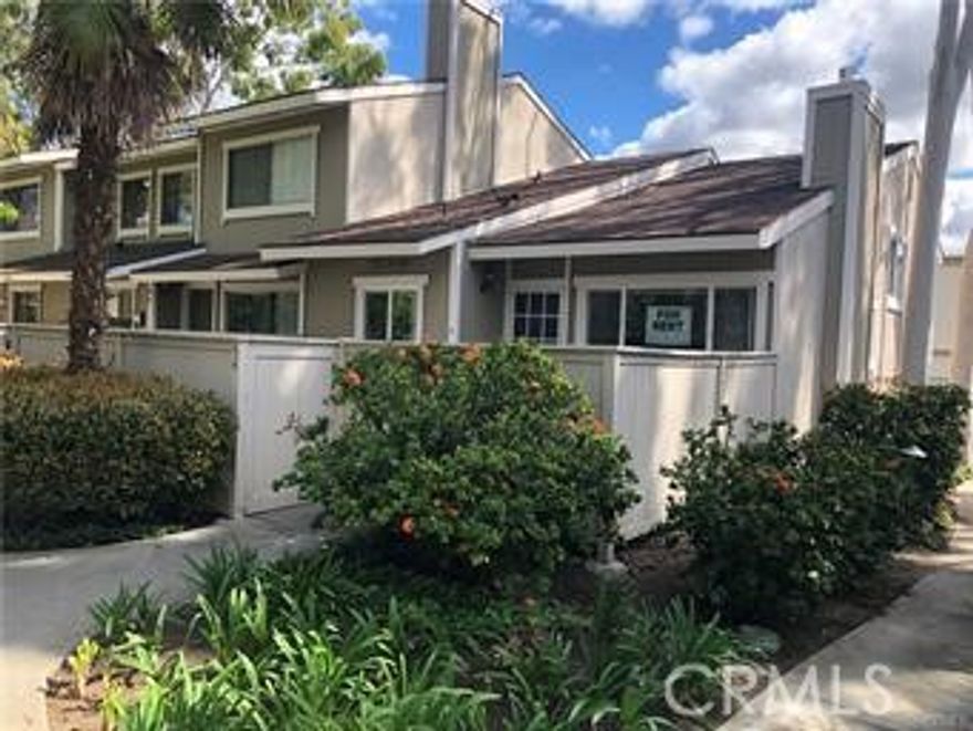 Gated community. End unit with nice front yard and attached two car garage. 2 bedroom 1.5 bath and cozy fireplace in living room.