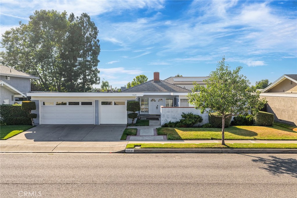 Welcome to 19491 Sierra Mia Rd — a beautifully upgraded single-level home in the highly sought-after Broadmoor enclave of Turtle Rock. This well-maintained residence features 4 bedrooms, 2.5 bathrooms, and approximately 2,016 square feet of comfortable living space on a spacious 7,600 sq ft lot, all located on a quiet, interior street.
Enjoy a light-filled open floor plan, designed for both everyday living and entertaining. The kitchen boasts a charming bay window at the sink, ample storage, and a separate breakfast nook. The living and dining rooms open to the backyard through French doors, creating a seamless connection to outdoor space. A cozy wood-burning fireplace anchors the living area. A separate family room provides additional living space and opens to the side yard through its own French slider.
The primary bedroom includes its own French slider to the backyard and features dual closets and a remodeled ensuite bathroom with a dual-sink vanity. Step outside to a private backyard with a mix of paved patio and grass—ideal for outdoor dining, lounging, or entertaining. A 3-car attached garage with roll-up doors offers plenty of storage and parking space.
Residents of this wonderful Turtle Rock community enjoy access to beautiful parks, pools, playgrounds, and top-rated Irvine schools, including Bonita Canyon Elementary, Rancho San Joaquin Middle, and University High School. Located just minutes from UCI, scenic hiking and biking trails, and shopping and dining.