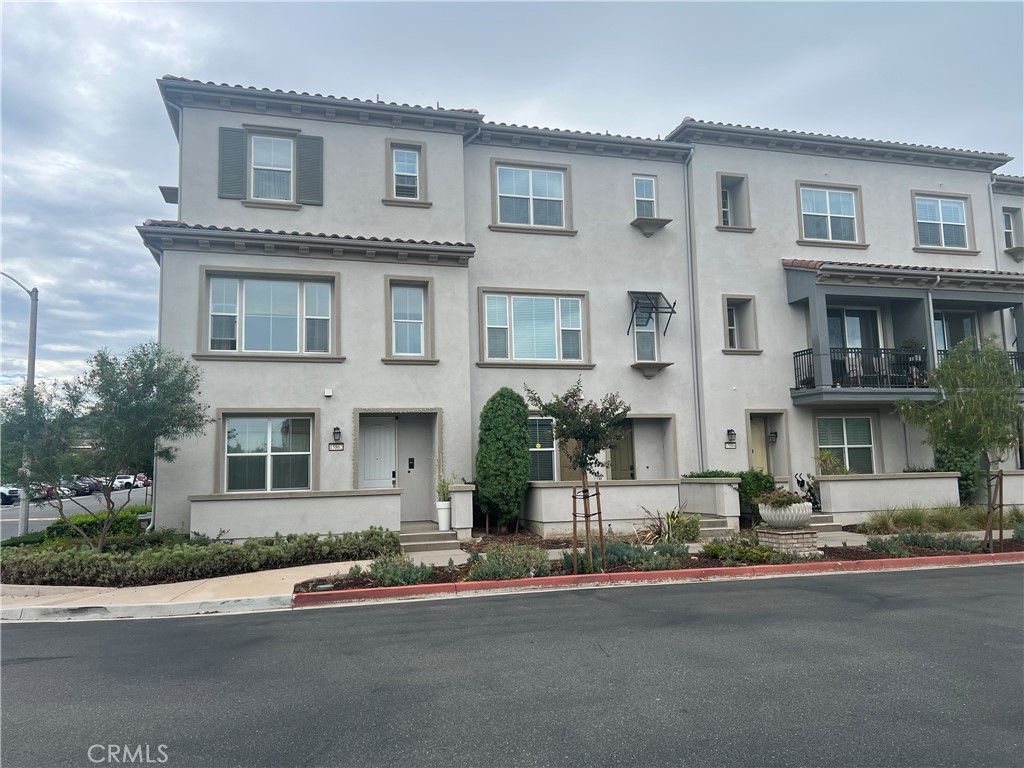 The beautiful 3 story townhouse located in a master planned community in Chino Hills. This house feature 1,848 sf of living space with 4 bedrooms and 3 full bathrooms. There is a downstairs bedroom with full bath, gourmet kitchen, open floor plan with $17,000 upgraded. 2-car attached garage, dual paned windows, tankless water and heating system, refrigerator, washer and dryer included. Step outside this chic home and take a short walk to an array of stores and restaurants. Excellent chino valley school district with high school. Easy to go on 71 freeway. All the luxuries you really want to be here in a charming natural for your life.