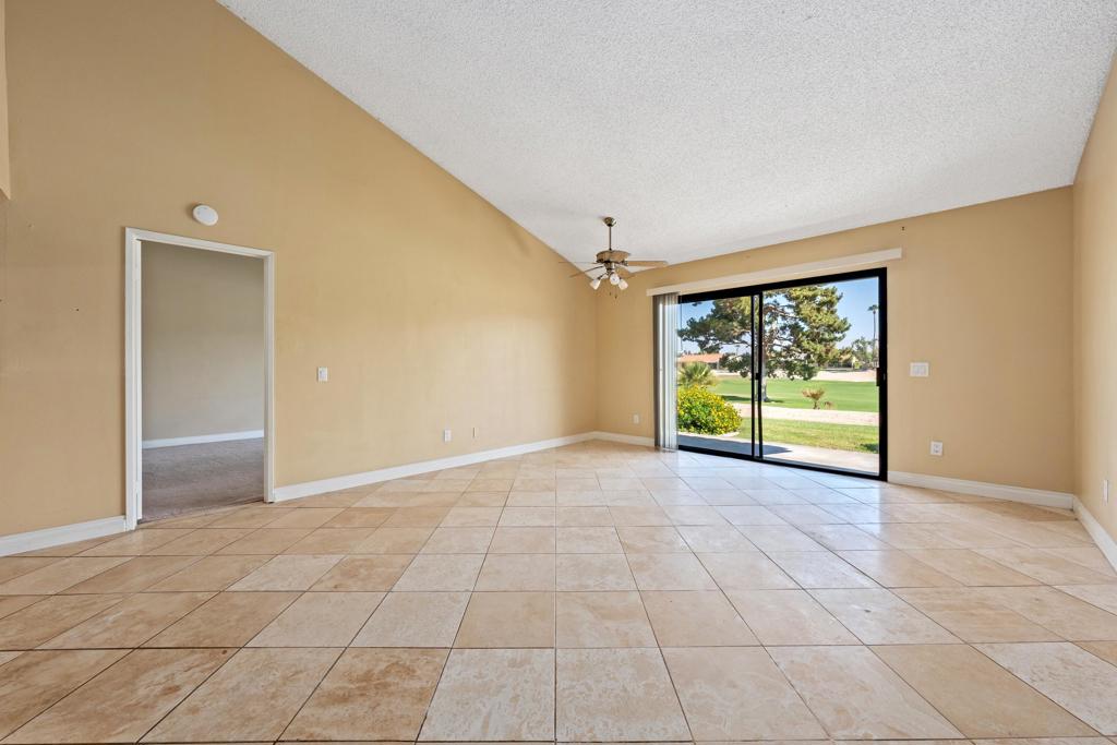 Located within the desirable Palm Desert Resort Country Club, this well-maintained 2-bedroom, 2-bathroom condo features the highly sought-after Vintage floorplan, offering an efficient and spacious layout with exceptional golf course views.This single-level end-unit provides a seamless flow from the entry into the open living and dining areas, complemented by high ceilings and expansive windows that frame uninterrupted views of the fairway. The north facing patio enhances the connection between indoor and outdoor living, offering a private vantage point overlooking the course's beautifully manicured landscape.The kitchen is designed for functionality, with ample cabinetry, a breakfast bar, and entertainment space. The primary suite includes direct patio access, a large closet, and an en-suite bath with walk-in shower. The secondary bedroom, located on the opposite side of the unit for privacy, is served by a full guest bath.Additional highlights include an attached carport, tile flooring in main areas, and abundant natural light throughout. The home is ideally situated on a quiet interior circle within the community, offering close proximity to community pools, spas, and tennis/pickleball courts.The Palm Desert Resort Country Club is a gated community offering 24-hour security, an 18-hole championship golf course, and a well-managed HOA that includes cable, internet, exterior maintenance, and landscape care.This is an excellent opportunity for a primary residence, seasonal retreat, or investment property with strong rental potential. Conveniently located near shopping, dining, and major desert attractions.