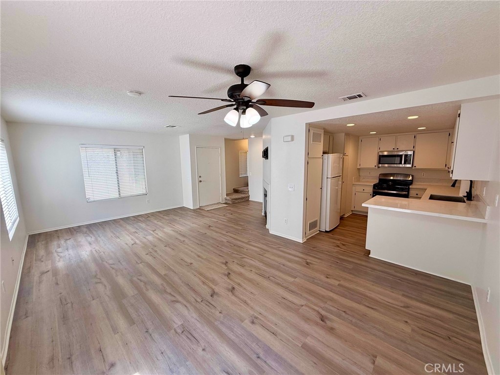 Recently Remodeled unit with 2 Primary Bedrooms upstairs each with their own bathroom! Step inside and enjoy this recently remodeled condo featuring Newer upgrades such as LVP flooring, Carpet, Paint, Kitchen with stainless steel appliances/quartz counters/breakfast bar, Newer bathroom vanities & toilets, Fixtures and more. Rent includes Water, Trash, Refrigerator, Washer & Dryer. No neighbors above or below your living areas for extra privacy. One (1) small dog up to 15lb might be considered. Enjoy your own private 2 car garage and HUGE outdoor patio area. Community features 2 pools, spa, tennis and basketball court. In the heart of Rancho Cucamonga and close to shopping, restaurants & freeways.