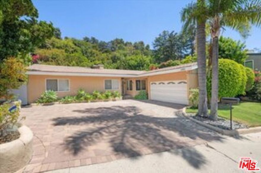 Tranquil and Spacious 3 bedroom, 2.5 bathroom home, located in one of the finest areas of Brentwood, North of Sunset. Living room, primary bedroom, den/family room off of the kitchen, all face a private backyard with a heated pool and lush landscaping. There are two other additional bedrooms with a shared bathroom. The primary bedroom has a spa bath tub and separate stalled shower. The large kitchen features built-in appliances and connects to the laundry room leading to an attached garage. The living room has a fire place and skylight. Additional features include newer central HVAC, recessed lightings, hardwood flooring and security camera system throughout. Lovely home for family style living and entertaining.