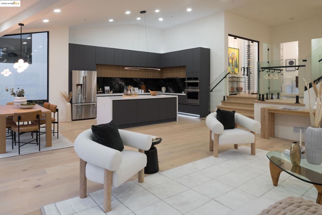 Step into a world of striking architecture and radiant light in this brand-new 4+ bedroom, 3 bath home nestled in desirable Montclair. From the moment you enter, dramatic ceilings and expansive windows create a breathtaking first impression. The main level features a sweeping open layout designed for contemporary living and stylish entertaining. A state-of-the-art kitchen with a sleek island anchors the space, flowing effortlessly into the dining area and family room. Glass doors open wide to a grand deck—perfect for seamless indoor-outdoor living. A glass-enclosed wine closet serves as a showpiece, ideal for displaying your favorite bottles, collectible spirits, or even a curated selection of art or memorabilia. A spacious guest suite with a full bath offers comfort and privacy on this level. Downstairs, a cozy lounge area connects three bedrooms and two full baths, creating an ideal retreat for family or guests. The primary suite is truly a work of art, complete with a spa-like bath featuring a soaking tub, oversized shower, private view deck, and a generous walk-in closet. Experience elevated living in one of Oakland’s most sought-after enclaves; where architecture inspires and every detail elevates with bold design, refined comfort, and a lifestyle that rises above it all.