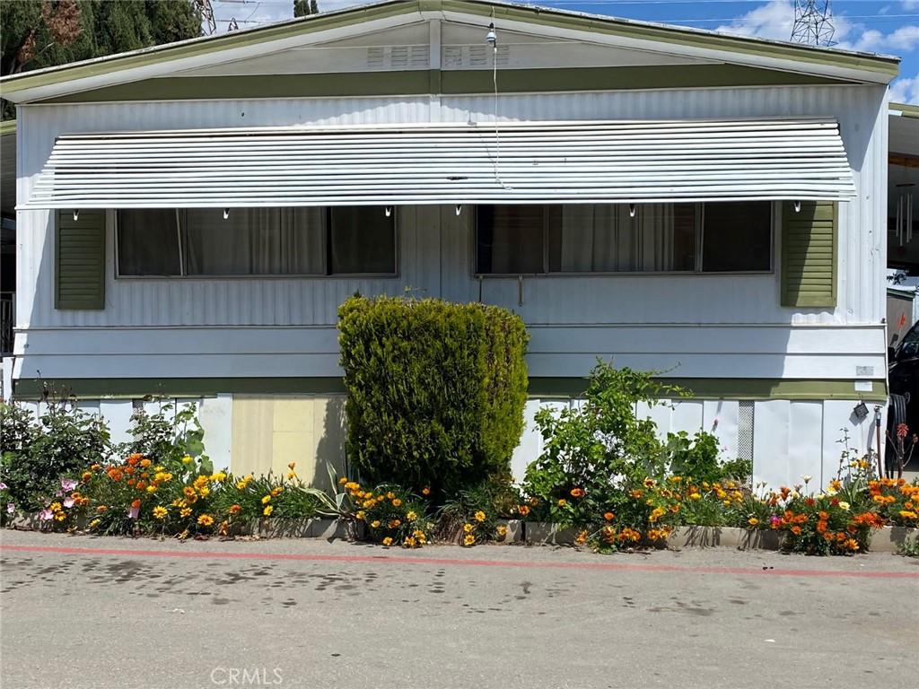 Welcome to Paradise Ranch Mobile Home Park! This mobile home offers 1536 sqft of living space! It is a three bedroom two baths including a BONUS ROOM!! The master bedrooms is located on the opposite side of the other bedrooms, perfect for privacy! The spacious master has a huge closet and huge bathroom! The open floor plan includes two living rooms! One can be a family room or another dining room! So much potential this home has! The kitchen is VERY specious with HUGE kitchen island for the perfect cook! The kitchen has enough room for a breakfast area table! The Second bedroom is very spacious and well maintained! The other room is also very spacious and right next to the second bedroom. Second bathroom is conveniently located by both bedrooms! The second bathroom is very spacious and has plenty of room for additional add on! The bonus room is almost twice the size of the regular rooms. Perfect for an office, storage or studio! The car port can fit up to two to three cars! Also includes a storage and side yard that is also gated surrounding the home. Must be approved by the mobile home park. Come and make this Paradise home yours today!