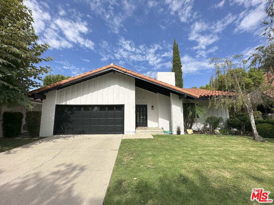 Fantastic opportunity to lease a beautifully maintained 4-bedroom home in one of Westlake Village's most desirable neighborhoods! Located on a peaceful cul-de-sac in the sought-after Village Homes community, this home offers access to excellent nearby HOA amenities including a pool, tennis courts, clubhouse, serene greenbelt trails, & Evenstar Park. It's also situated in an award-winning school district. The home features a bright, open & flowing layout with formal living room offering a fireplace, large window, & skylight for abundant natural light. The dining room sits just off the living area, ideal for gatherings. Open-concept great room also features a skylight & connects seamlessly to the kitchen, which is updated with new stainless steel appliances, granite countertops, & stone backsplash. The family room has a sliding door that leads to a serene backyard with a pergola-covered patio, perfect for entertaining & outdoor dining, plus a grassy area with fruit trees. The primary suite includes dual closets, slider with direct access to the backyard, & an en-suite bath with spa-style tub/shower. There are also 3 additional well-sized bedrooms & a hall bathroom with tub/shower, new vanity & mirror. Additional features include hardwood floors in the main living areas, newer carpet in most bedrooms, recessed lights, central A/C, updated fixtures, & a two-car garage with direct access. All just minutes from shops, dining, & everything Westlake Village has to offer.
