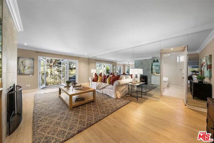 A lovely and upscale 2-bedroom and 2-bathroom condo unit is nestled in the prestigious Bel-Air neighborhood. Bright and beautiful, West facing canyon views! Thoroughly upgraded and remodeled stunning condo on first level. Gorgeous hardwood flooring, fire place, quartz kitchen with a new fridge and all appliances. Two expansive decks/balconies. Huge walk in closets plus storage spaces, wet bar, built in custom book cases and leaded glass french doors. Quiet building with heated pool, rec room, well outfitted gym and sauna. Assigned underground parking for 2 cars with additional garage storage unit. Located at the top of Bel Air, just a short walk to Roscomare Road elementary school, minutes from Sherman Oaks or Westwood Village.