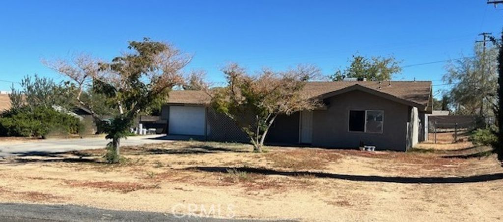 Photo of 7387 Aster Ave, Yucca Valley, CA 92284 (MLS # IV25256371)