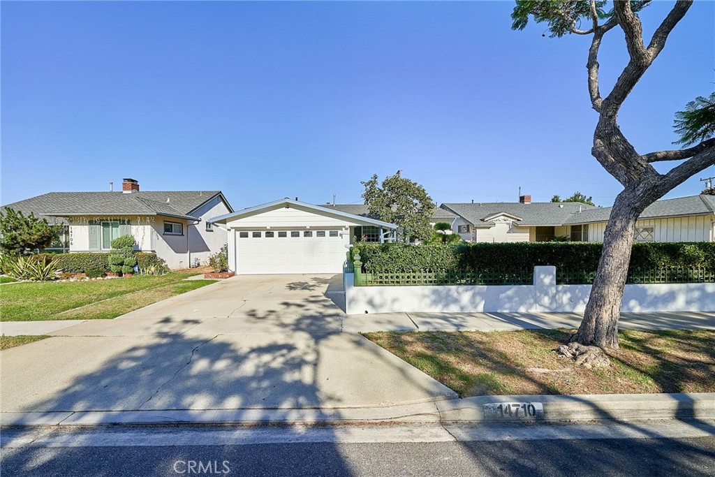 This stunning single-family home, nestled in a tranquil Gardena neighborhood, boasts 1,770 sqft of living space—250 sqft of which was thoughtfully added with permits. The open floor plan is enhanced by gleaming hardwood floors and recessed lighting throughout, creating a spacious and inviting atmosphere. The expansive living room opens up to a beautiful patio, perfect for entertaining. The upgraded kitchen features large tile flooring and sleek stainless steel appliances. A charming master suite with an en-suite bath, as well as upgraded bathrooms with granite counters and large tiles, provides a touch of luxury. The property also offers a secluded front yard and a peaceful orchard-style backyard. Additional highlights include a permitted laundry area and patio. a two-car attached garage. A true must-see!