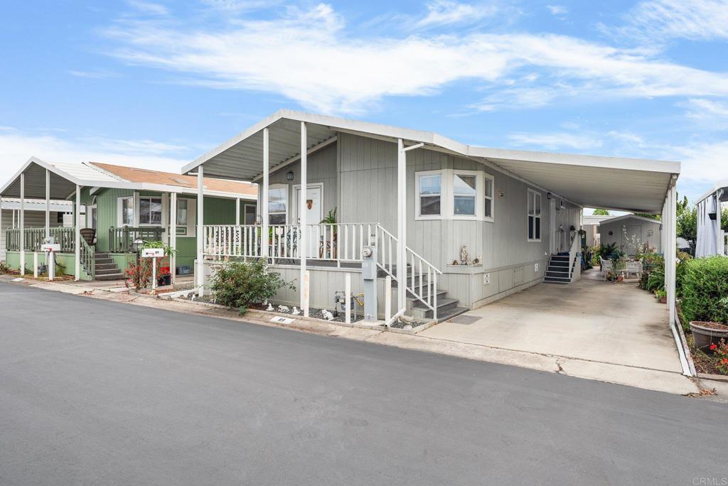Welcome to Vista at 1010 E. Bobier Dr., Space #89. This beautifully well-maintained home is nestled in a quiet senior community close to shopping, restaurants, and public transportation. This home has a nice front porch to sit out and enjoy the fresh air, cool breeze and a peaceful setting. This 2004 Manufactured home is a 2-bedroom, 2-bath with an open concept to a den with lots of room to enjoy with your family. The kitchen has a large pantry and skylight. Laundry room has extra cabinetry and countertop. Master bath has a garden tub and a separate shower. Recently re-leveled. Newer water heater. Parking for 3 cars or room to add a sitting area. Ideal location and motivated seller! Must see!