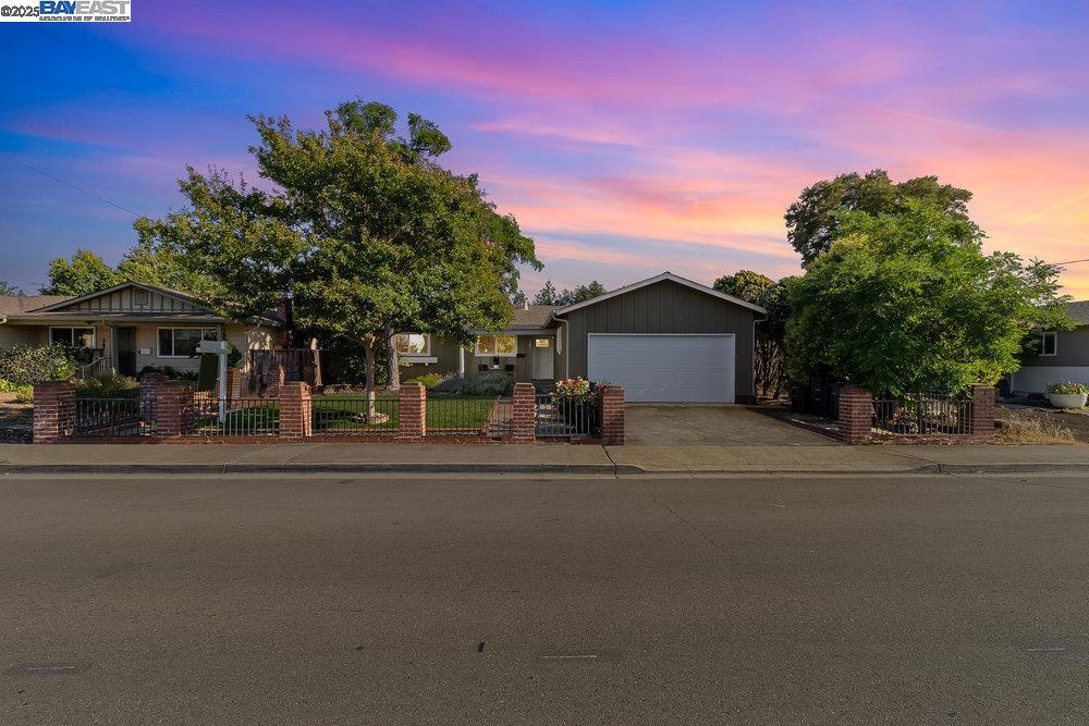 Welcome to this updated 3-bedroom, 2-bathroom home located in the highly sought-after Jensen Tract neighborhood of Livermore. Bursting with curb appeal and timeless character, this home offers a perfect blend of comfort, functionality, and charm. Step inside to find a light-filled living space with an open layout that seamlessly connects the living, dining, and kitchen areas — ideal for everyday living and entertaining. The primary suite offers a peaceful retreat with an en-suite bathroom, while two additional bedrooms provide flexibility for a growing family, home office, or guest space. Both bathrooms are tastefully remodeled with modern finishes. Outside, enjoy a spacious backyard with a patio area perfect for BBQs and outdoor dining, and plenty of space for gardening or play. Situated just minutes from Livermore’s vibrant downtown, top-rated schools, parks, wineries, and easy freeway access, this home truly has it all! Don't miss your chance to own a piece of one of Livermore’s most established and desirable neighborhoods!