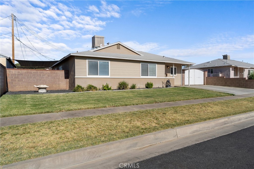 This beautiful home was renovated with too many upgrades to note! The home boasts a stunning kitchen remodel with granite counter tops, upgraded cabinetry, appliances and an island with bar seating. The home has recessed lighting throughout and a gorgeous, wood look, tile plank flooring in all common areas. The bathrooms are fully upgraded with custom tile in shower, custom vanities and more! The rooms are very large. The Primary bedroom was expanded by converting the fourth bedroom (title says 4 beds) to make a spacious room with full on suite. The home sits on a larger lot with RV access, detached 2 car garage, private garden paradise, chicken enclosure (can be used for other animals) And MORE. NO HOA, NO MR! This is a MUST SEE home that will not last long.
