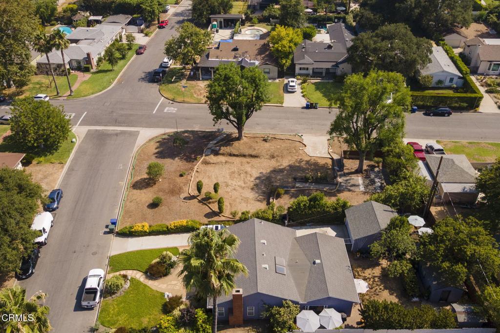 Set on a spacious 9,170 square foot corner lot (per assessor) dotted with established trees and mature landscaping, this mountain view property is located in the unincorporated area of Pasadena and presents a rare opportunity to rebuild in a well-established neighborhood. The previous home, a 1,637 square foot residence with 4 bedrooms and 3 baths, was impacted by the recent Eaton Fire - yet the surrounding block is full of long-standing residences, highlighting the area's stability, charm, and strong sense of community. The location is exceptional - just a short stroll to East Washington Village, where beloved local spots like Connal's, Carmela Ice Cream, Bloomfield Creamery, and Burrito Express sit alongside coffee shops, markets, and dining. A neighborhood jazz club brings a touch of nightlife to the area, while Hastings Ranch shopping, the Metro, and conveniences for daily errands are all within easy reach. Outdoor and community amenities abound as well, with Alice's Dog Park, Victory Park, Roseways bike path, and the lively Saturday Farmers' Market close at hand.For those looking to build a dream home, the lot offers ample space, mountain views, and a welcoming neighborhood known for its shady streets and community spirit. For developers and investors, the oversized corner lot and history of supporting a sizable home and perhaps space for an ADU demonstrate both flexibility in design and long-term value potential in one of Pasadena's most desirable enclaves.Fully cleared and ready for building, this lot provides flexibility for redevelopment. Buyers are advised to confirm all zoning, development guidelines, and utility connections with Los Angeles County and relevant service providersPlease drive by only and no trespassing onto the property.Don't miss the opportunity to make this property 'Where Your Home Happens.