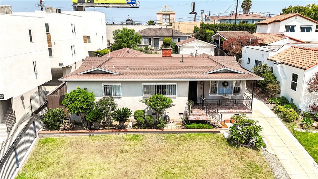 Welcome to 4933 W 20th Ave, a spacious single-story home in the heart of Los Angeles’ thriving Mid-City neighborhood. Situated on a huge 9,035 sq ft lot with 2,865 sq ft of living space, this residence combines comfort, versatility, and income potential.
The main house offers 4 bedrooms and 2 ½ baths, featuring a remodeled master bathroom, kitchen has quartz countertops, and a massive family room that flows into a large open floor plan — perfect for entertaining and everyday living.
Adding to its appeal, the property includes a separate two-bedroom, one-bathroom unit in the back, ideal for generating extra rental income, multigenerational living, or a private guest suite. The back unit is upgraded with 220 electrical, washer and dryer hookups, and modern conveniences.
Outside, enjoy stunning curb appeal with landscaped front and backyards, a long cement driveway leading to a two-car detached garage, and a large patio area for outdoor gatherings.
Located minutes from some of Los Angeles’ most iconic destinations — including LACMA, the La Brea Tar Pits, The Grove, and Melrose Avenue — this home offers an unbeatable combination of space, upgrades, location, and investment opportunity.
With its expansive lot, generous living space, and bonus income unit, this property is truly a rare find and a great deal in today’s market.