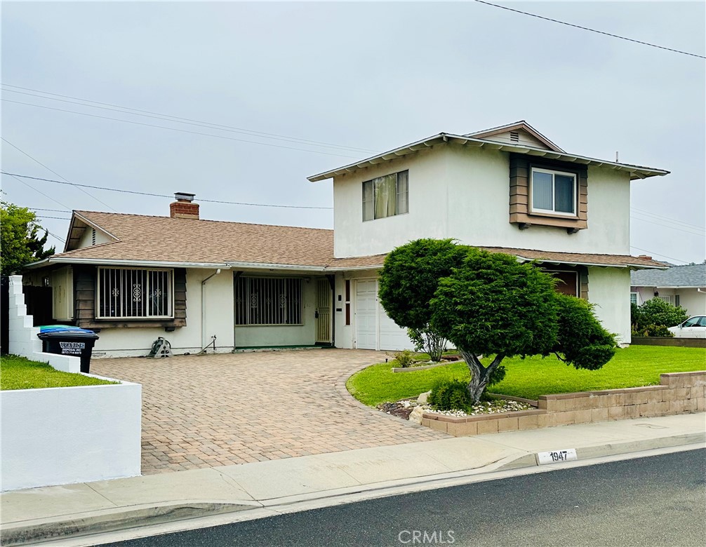 This unique home is brimming with potential and ready for a buyer's personal touch to make it shine! It is one of the only homes in the area with a second floor addition. This addition adds a huge 4th bedroom complete with en-suite bathroom, large wall closet, and a desk nook. Downstairs features 3 additional bedrooms. One of those bedrooms is semi private and uses an accordion door for separation. This bedroom has direct access to a bathroom and to the back yard as well. One of the other bedrooms has a wall closet and is also attached to a large walk in closet/storage space. This bedroom also has direct access to the 1 car garage. A full bathroom and linen closet are conveniently located in the hallway. The living room has a large fireplace and flows into the dining room. The dining room is a good size and located adjacent to the kitchen which offers lots of cabinet space, ample counter tops, and access to the laundry room and backyard. Outside you will find an inviting pool and a covered patio creating the perfect space to entertain or relax while enjoying the views of Downtown Los Angeles. Bring your vision, roll up your sleeves, and make this home shine!
