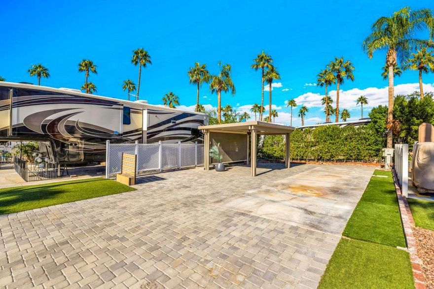 I am pleased to present an exceptional new listing: Lot 85 a premium paved property that offers a truly distinguished outdoor experience. Newly built shade structure on the lot--10'x14' permanent AlumaWood structure (zero maintenance)-built to withstand 125 mph winds-sloped roof with gutters-recessed dimmable lighting-ceiling fan-custom roller shades for wind, sun and privacy-$15k+ structureLocated directly opposite the golf course, this location affords not only picturesque views but also unparalleled accessibility to leisure activities. The lot itself has been meticulously developed. Walking distance to an array of amenities including an on-site restaurant, fitness center, pool, spa, and shower facilities, all designed to enhance your experience.