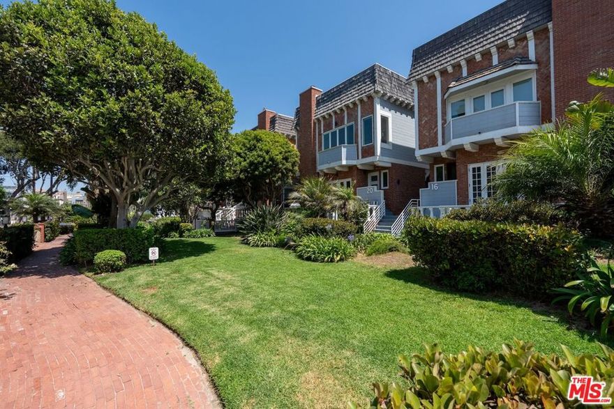 Located on one of the most charming walk streets on the Marina del Rey Peninsula, this spacious 4-bedroom, 3-bath condo, close to the beach, offers nearly 2,000 sq ft of beautifully designed living. It features a dramatic living room with high ceilings and built-in bar perfect for entertaining. French doors open to a lovely balcony overlooking the landscaped mall with a view of the ocean. The chef's kitchen boasts stone countertops, custom cabinetry, and stainless appliances, flowing perfectly into a beautiful dining space. The generous primary suite includes a private balcony, walk-in closet, and spa bath, with dual sinks, separate tub, and shower. One of the bedrooms functions as an office, which can be converted back to a closet. Another bedroom has a private entrance-ideal for guests or extended family. Includes 3-car garage parking. A rare offering in an unbeatable location!