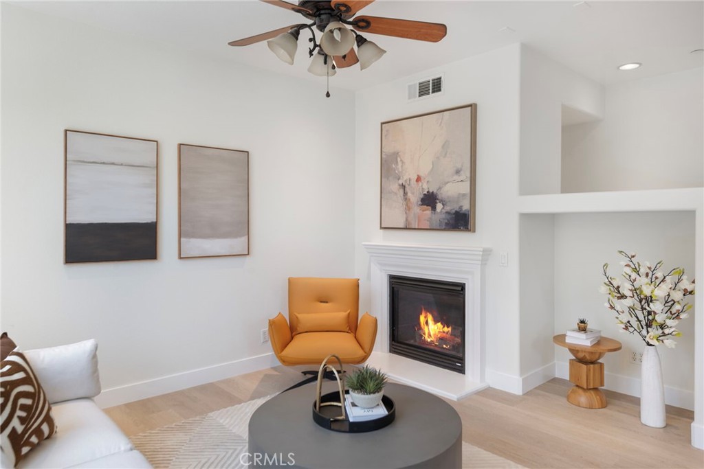 This bright, move-in ready corner condo in desirable Portola Springs features 3 bedrooms and 3 bathrooms with thoughtful upgrades throughout. The entry level includes a private bedroom and full bath, ideal for guests, in-laws, or a home office, along with a separate laundry room for added convenience. The second floor main living area features an open-concept design filled with natural light. Enjoy a cozy fireplace in the living room, a generous dining area, and a modern kitchen complete with a large center island, perfect for meal prep and entertaining. A second bedroom and full bath are also on this level, offering comfort and flexibility. Upstairs, find a luxurious primary suite with dual walk-in closets and a spacious bathroom with a shower, tub, and dual vanities. Enjoy resort-style amenities including community pools and spa, tennis and basketball courts, parks, and walking/biking trails. Zoned for award-winning Irvine Unified School District and a short walk to Portola Springs Elementary, the home is also minutes from Woodbury Town Center, Irvine Spectrum, Great Park Sports Complex, and the upcoming Canopy Shopping Plaza.