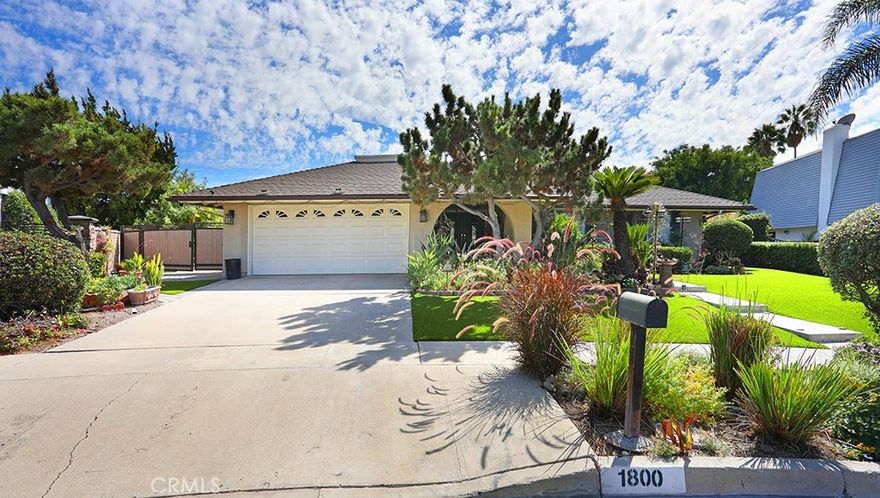 Welcome to one of Fullerton’s most desirable neighborhoods! This charming single-level home offers 3 bedrooms, 2 bathrooms, and 1,690 sq. ft. of living space on a spacious .28-acre lot/(12,000 Sq.Ft). Step through the impressive double-door entry into a bright and inviting interior. The dining and living rooms are enhanced with beautifully maintained travertine stone flooring, creating a timeless and elegant feel. The remodeled kitchen features premium granite countertops, perfect for the home chef who loves both style and functionality. Natural light pours in through abundant double-pane windows and French doors, filling the home with warmth. The living room highlights three designer wall niches with accent lighting, while the master suite opens to a private elevated deck overlooking the backyard and includes a custom walk-in closet. The expansive backyard provides endless possibilities for entertaining, relaxing, or creating your dream outdoor retreat. Additional conveniences include custom automatic doors and thoughtful design details throughout. Don’t miss the opportunity to make this stunning Fullerton home your own!