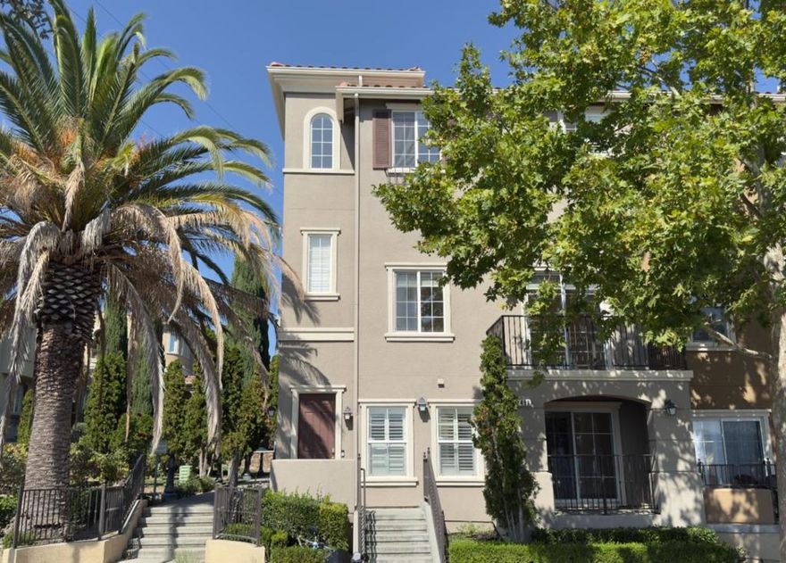 Welcome to this stunning end-unit townhouse on highly sought-after Communication Hill, where breathtaking views and unforgettable sunsets await. With over 2,250 sq. ft. of living space, this residence offers the perfect balance of comfortable everyday living and effortless entertaining.  Thoughtful details include soaring vaulted ceilings, recessed lighting, central heating and cooling, an in-home washer and dryer, smart thermostat, Ring doorbell, dedicated laundry room, and a spacious two-car garage for ultimate convenience.  The beautifully updated kitchen is a true showpiece, featuring quartz countertops, an expansive island that doubles as the perfect gathering spot, sleek stainless steel appliances, and modern cabinetry.  Sunlight pours through energy-efficient windows, illuminating elegant engineered hardwood floors throughout. The primary suite is a serene retreat with a generous walk-in closet and a tastefully renovated bathroom.  Ideally located just minutes from Vieira Park, shopping, dining, public transit, light rail, and major highways, this home offers both lifestyle and convenience in one remarkable package.