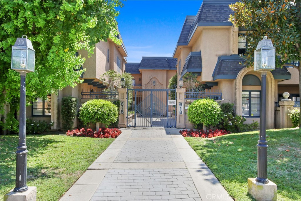 Experience stylish comfort and convenience in this beautiful 2-bedroom, 2.5-bath townhome, offering 1,789 sq. ft. of bright, open living space in a secure gated community in Arcadia. Perfectly situated in one of the best locations within the community and opening to the courtyard, this home features the largest private patio, enhanced with custom wood flooring for a touch of comfort and elegance. The move-in-ready home welcomes you with a spacious living room and cozy fireplace, a bright kitchen with stainless steel appliances, and a dining area that flows seamlessly to the patio for easy indoor-outdoor living. Upstairs, you’ll find generously sized bedrooms, including a serene primary suite with a walk-in closet and spa-like bathroom. Additional highlights include sleek new flooring, in-unit laundry, two assigned subterranean parking spaces, and a large bonus storage room for added functionality. Residents will appreciate this award-winning community’s charming courtyard, lush landscaping, and proximity to vibrant local shops, dining, and amenities. With water, trash and earthquake insurance included in the HOA and a recently replaced roof and fascia, this turnkey home blends style, comfort, and practicality in one inviting package.