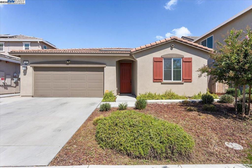 Welcome to this beautifully maintained single-family home, built in 2021 and thoughtfully designed for modern living. Offering 4 spacious bedrooms and 2 bathrooms, this home features an open-concept kitchen that flows seamlessly into the living and dining areas — perfect for entertaining family and friends. A built-in surround sound system makes movie nights a true experience. Enjoy the benefits of owned solar, providing energy efficiency and long-term savings. The low-maintenance yard allows for more time to relax and enjoy your home. Conveniently located just minutes from Lathrop Marketplace and with quick access to Highway 5, commuting and shopping are a breeze. Don’t miss the opportunity to make this well-cared-for home yours!