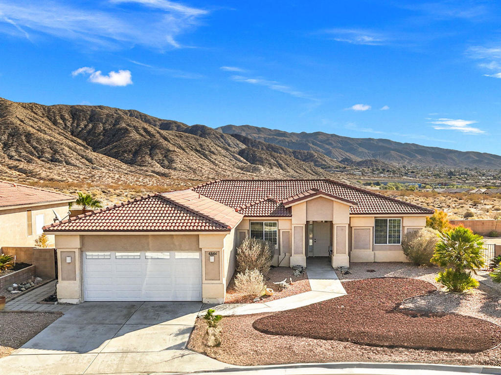 Welcome to this spacious, one-level home in the 55+ community of Paradise Springs. Enter through the inviting covered front patio into an expansive open concept living, dining, and kitchen area, perfect for both relaxation and entertaining. The formal dining room is currently being used as a home office, offering versatility for your needs. Through the sliding doors, enjoy your private walled-in backyard with a large, covered patio, ideal for outdoor living while you absorb the stunning eastward views of the valley and surrounding mountains. The generously sized primary bedroom suite is tucked away on the north side of the home, offering privacy combined with a large bathroom with a walk-in therapy/soaking tub. Two guest bedrooms, located on the opposite side of the home, share a full guest bathroom, ensuring comfort for visitors. Situated near the kitchen is a convenient powder room which is adjacent to a large laundry area leading into the two-car garage with a new garage door motor. Other recent updates include brand-new carpeting in all three bedrooms, along with new kitchen appliances -- refrigerator, stove, and microwave. Beyond the beautiful home, the Paradise Springs HOA takes care of the community grounds and security gate, providing privacy and peace of mind. Enjoy a variety of amenities including a clubhouse with banquet facilities, BBQ area, card room, exercise room, large community pool, and a relaxing spa. Come experience the charm and comfort of this home in Paradise Springs!