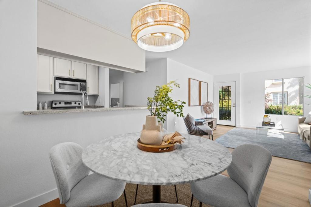 Amazing corner unit in a peaceful park like setting. Modern Elegance Awaits! Discover your dream home in the heart of Silicon Valley! This gorgeous ground-floor end unit, radiates bright, airy vibes w/brand-new updates that elevate every detail: Gleaming Oak LTV floors, fresh paint, sleek LED lighting & chic modern hardware create a sophisticated ambiance throughout. Step into the open-concept living area, where natural light pours in, seamlessly connecting the stylish modern kitchen & dining space perfect for entertaining or cozy nights in. The spacious primary suite offers a serene retreat, w/ double sink vanities, granite counters and LED lighting while the private patio showcases mature garden views w/lush fruit trees, blending tranquility & natural beauty. Located just minutes from tech giants like Broadcom, Nvidia, Intel, Google, Cisco, Micron & Cadence in addition to walking trails & nearby parks. Enjoy the convenience of an oversized attached garage w/extra storage, in-unit washer/dryer & ample guest parking. This quiet condo w/low HOA's is a rare gem in a coveted community w/its glistening blue pool & beautiful grounds for your daily walks. Experience modern living at its best! **Don't miss out this move-in-ready masterpiece wont last long!**Modern living at its best!