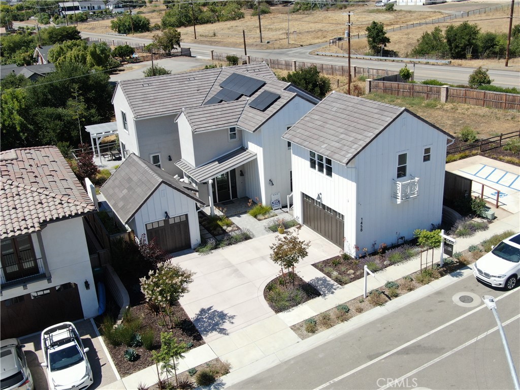 *Up to $50k in additional seller's concessions offered, inquire for more information.* The last model home in the Enclave- Righetti Ranch community is now available! This beautiful former model home features 4 beds, 4.5 baths plus a 1 bed/1 bath guest suite with a wet bar—offering a total of 3,836 sqft of luxury living space! The open-concept layout, vaulted ceilings, designer finishes, and gourmet kitchen with high-end commercial appliances make this an entertainer’s dream. This home has a Paramount Quartzite island, wire-brushed European Oak wood floors, high-end Wolf Appliances with a full range, and a SubZero refrigerator and full-size wine fridge. Enjoy the beautifully landscaped backyard, side courtyard, and built-in outdoor kitchen, perfect for hosting. This home has 2-car garage that sits below the guest suite and a detached 1-car garage, perfect for a storage area or gym. The ground floor bedroom is currently staged as an office area but can be easily converted into a bedroom. Located conveniently just 5 minutes from both downtown SLO and Edna Valley, you won't want to miss this opportunity!