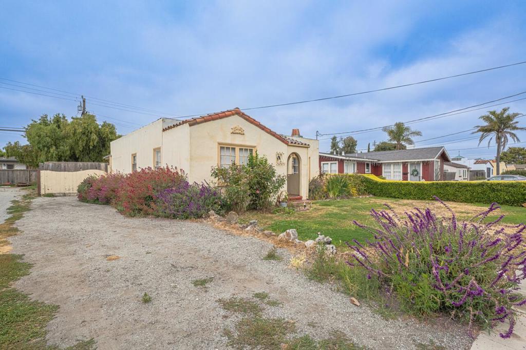 Lovely single level 2 bedroom 1 bath home close to everything in downtown Salinas! City of Salinas says this property qualifies to convert the rear garage/workshop to a second unit! Being sold with 50 Katherine - next door ad additional cost.